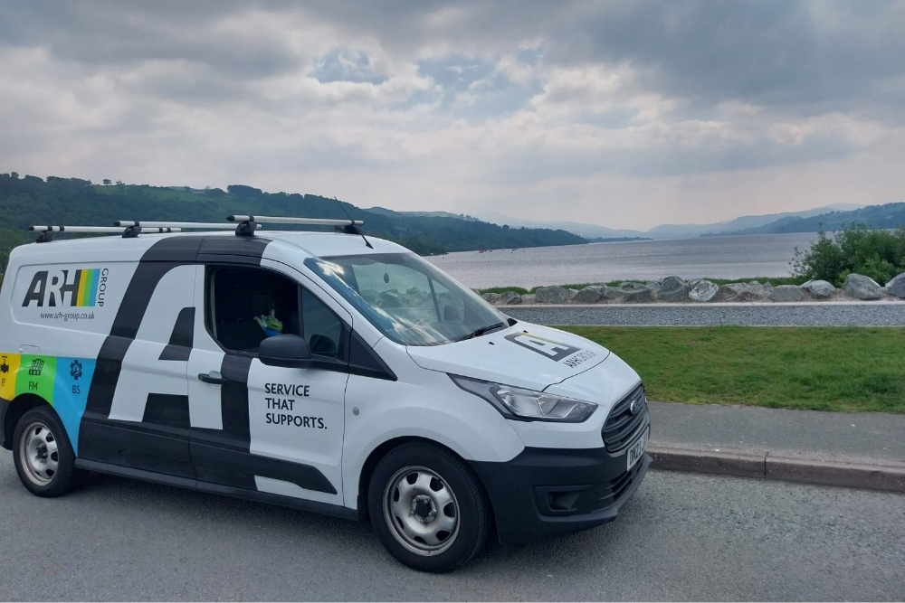 ARH Group van set against a peaceful lakeside backdrop, reflecting service reliability in every location.